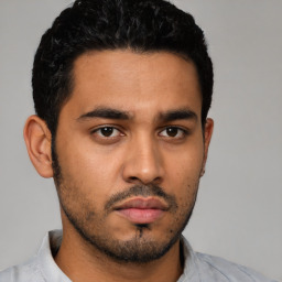 Neutral latino young-adult male with short  black hair and brown eyes