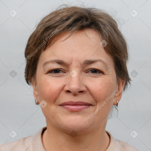 Joyful white adult female with short  brown hair and brown eyes