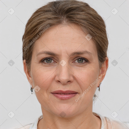 Joyful white adult female with short  brown hair and grey eyes