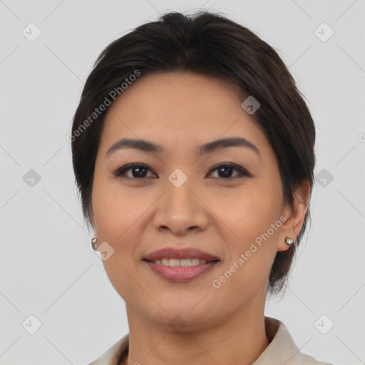 Joyful asian young-adult female with short  brown hair and brown eyes