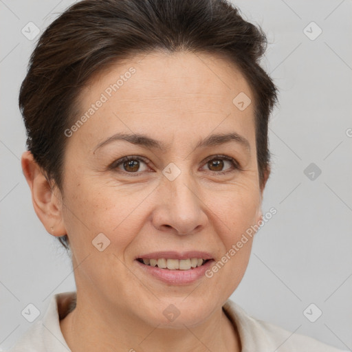 Joyful white adult female with short  brown hair and brown eyes