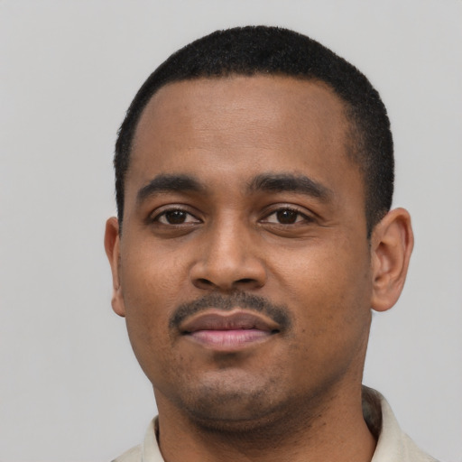 Neutral black young-adult male with short  black hair and brown eyes