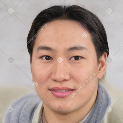 Joyful asian young-adult male with short  brown hair and brown eyes