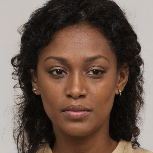 Neutral black young-adult female with long  brown hair and brown eyes