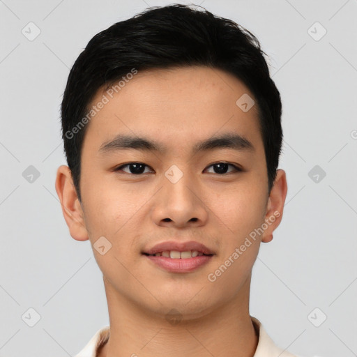 Joyful asian young-adult male with short  black hair and brown eyes