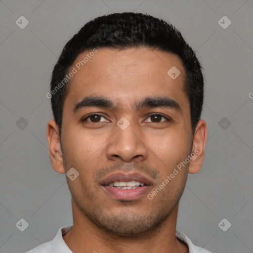 Joyful latino young-adult male with short  black hair and brown eyes