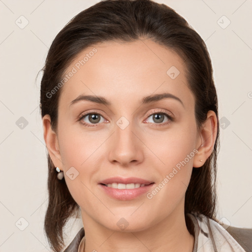 Joyful white young-adult female with medium  brown hair and grey eyes