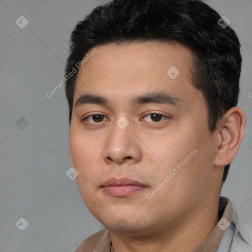 Joyful white young-adult male with short  black hair and brown eyes