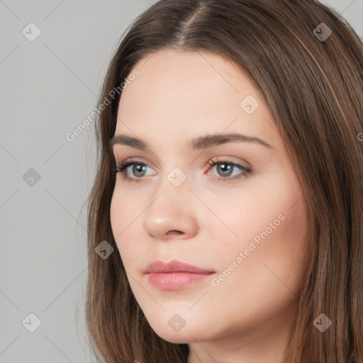 Neutral white young-adult female with long  brown hair and brown eyes