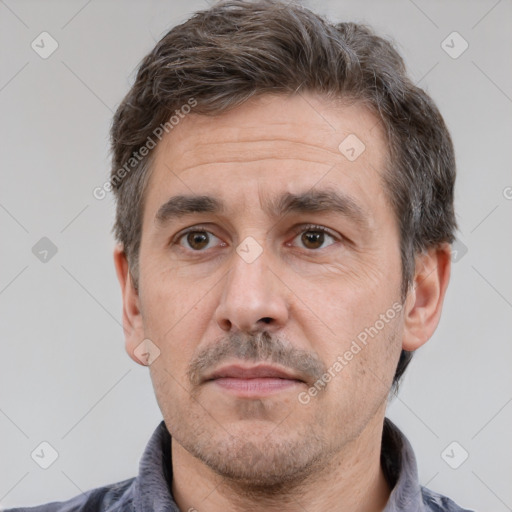 Neutral white adult male with short  brown hair and brown eyes