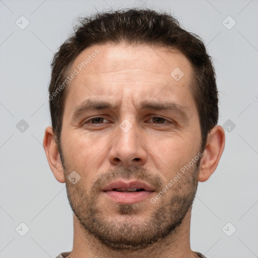 Joyful white adult male with short  brown hair and brown eyes