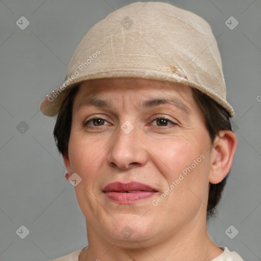 Joyful white adult female with short  brown hair and grey eyes