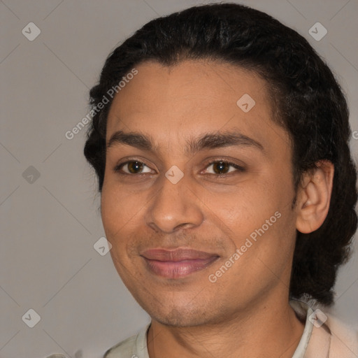 Joyful latino young-adult male with short  black hair and brown eyes