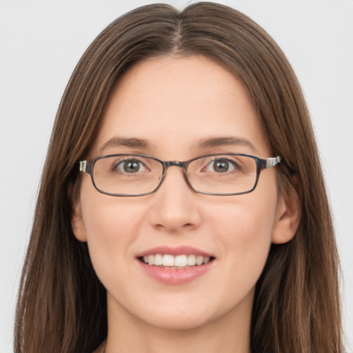 Joyful white young-adult female with long  brown hair and grey eyes