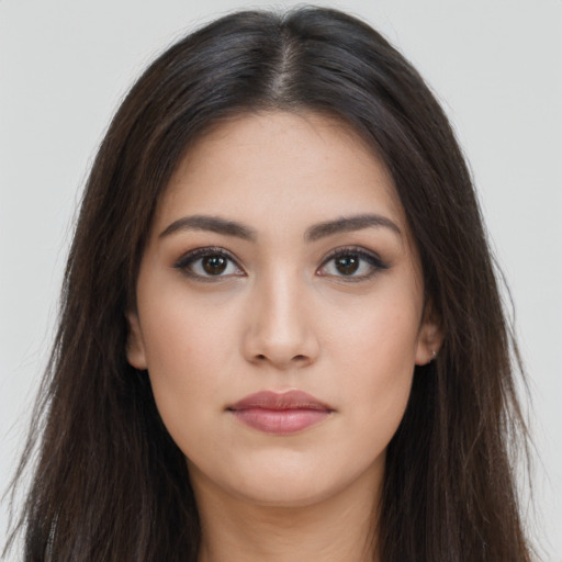 Neutral latino young-adult female with long  brown hair and brown eyes