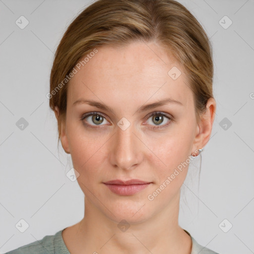 Joyful white young-adult female with medium  brown hair and green eyes