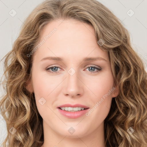 Joyful white young-adult female with long  brown hair and blue eyes