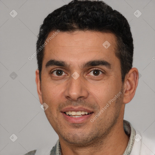 Joyful white young-adult male with short  black hair and brown eyes