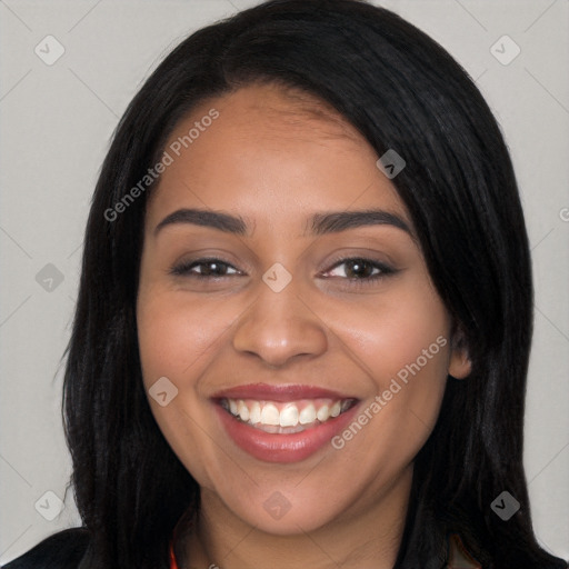 Joyful latino young-adult female with long  black hair and brown eyes