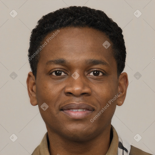 Joyful black young-adult male with short  brown hair and brown eyes