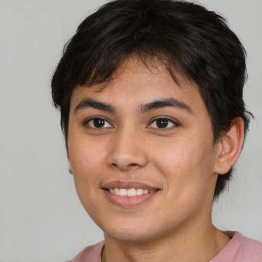 Joyful asian young-adult female with short  brown hair and brown eyes