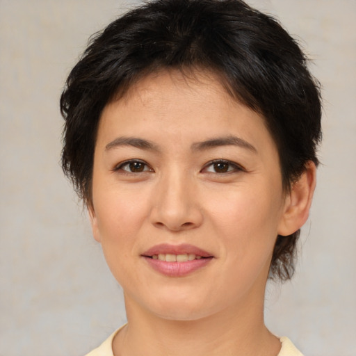 Joyful asian young-adult female with medium  brown hair and brown eyes