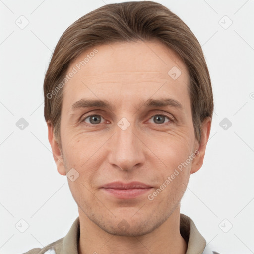 Joyful white adult male with short  brown hair and grey eyes