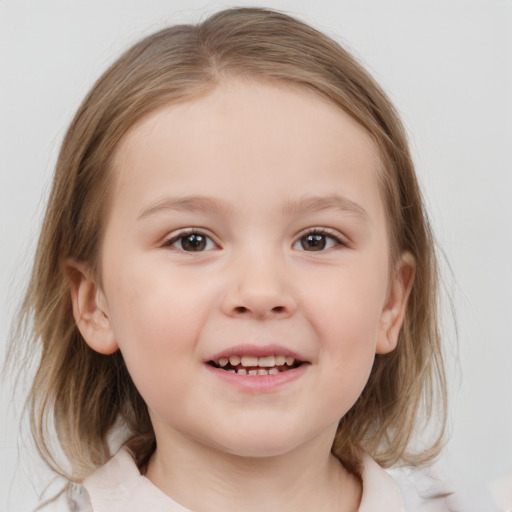 Joyful white child female with medium  brown hair and blue eyes