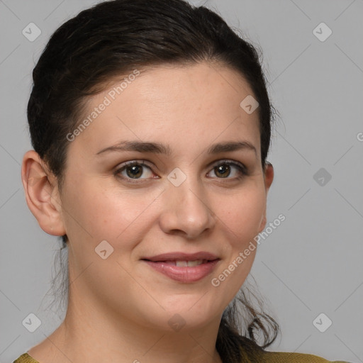 Joyful white young-adult female with medium  brown hair and grey eyes