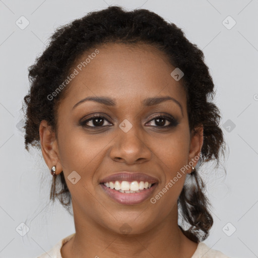 Joyful black young-adult female with medium  brown hair and brown eyes