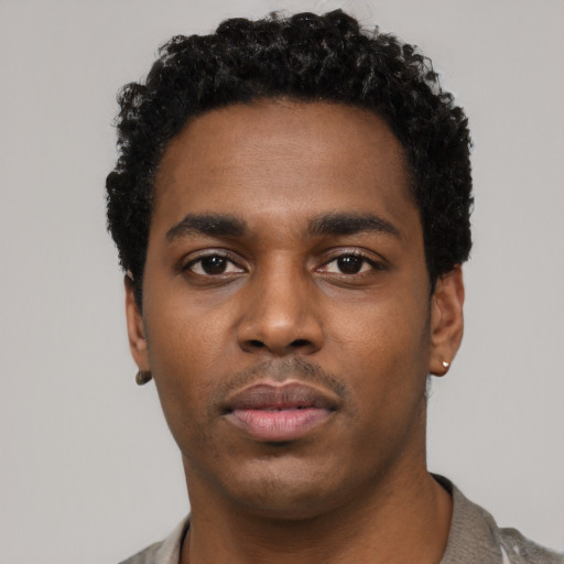 Neutral black young-adult male with short  black hair and brown eyes