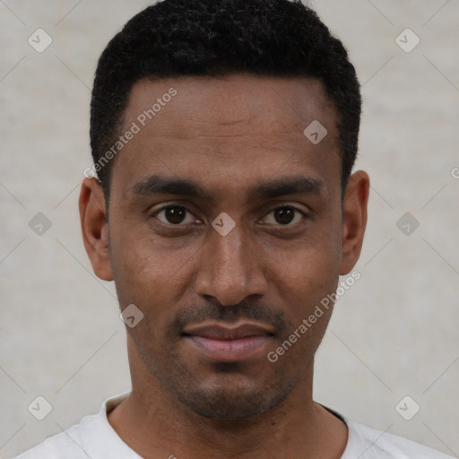 Joyful black young-adult male with short  black hair and brown eyes