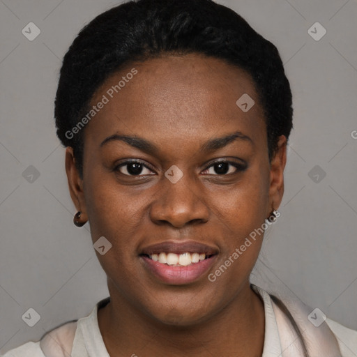 Joyful black young-adult female with short  black hair and brown eyes