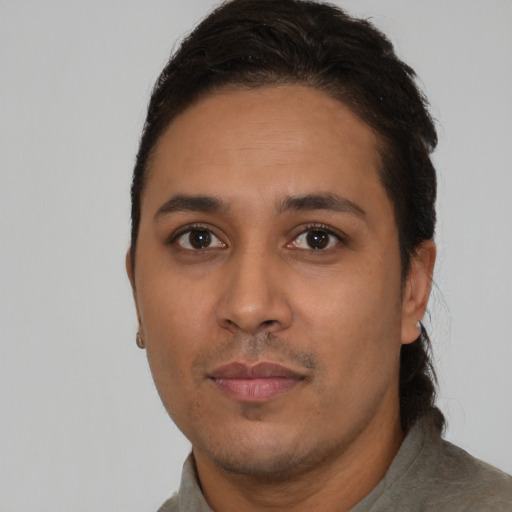 Neutral latino young-adult male with short  black hair and brown eyes