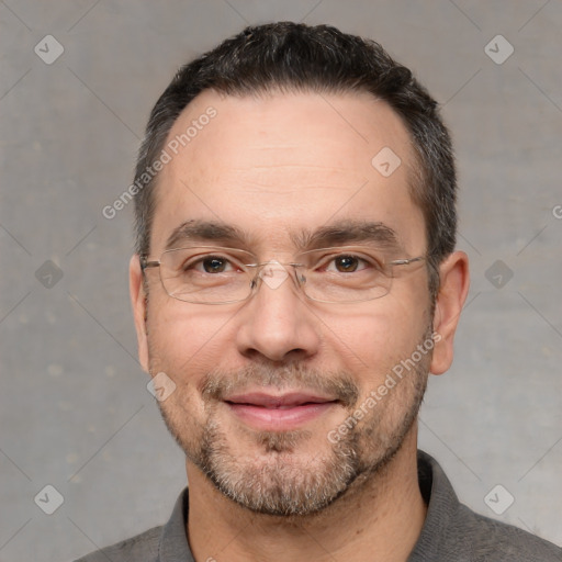 Joyful white adult male with short  black hair and brown eyes