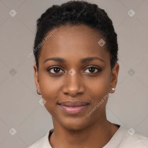 Joyful black young-adult female with short  black hair and brown eyes