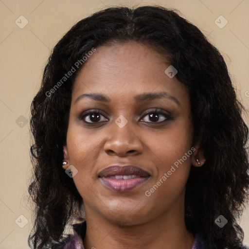 Joyful black young-adult female with long  black hair and brown eyes