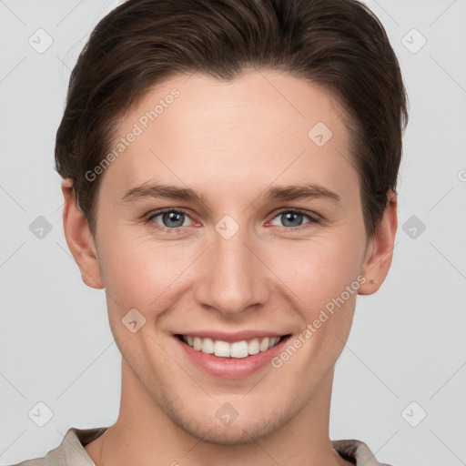 Joyful white young-adult female with short  brown hair and grey eyes