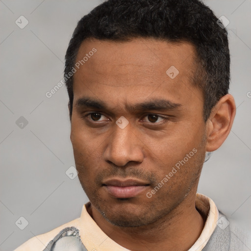 Neutral latino young-adult male with short  black hair and brown eyes