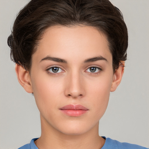 Neutral white young-adult female with short  brown hair and brown eyes