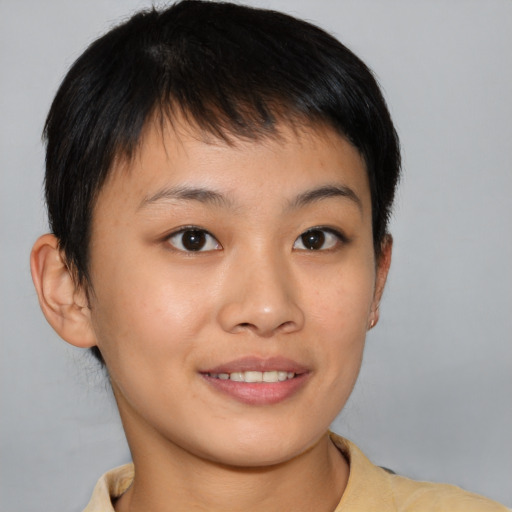 Joyful asian young-adult female with short  brown hair and brown eyes