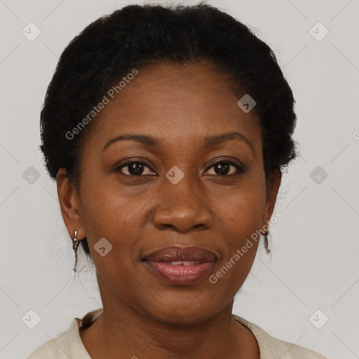 Joyful black adult female with short  brown hair and brown eyes