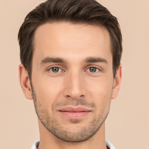 Joyful white young-adult male with short  brown hair and brown eyes