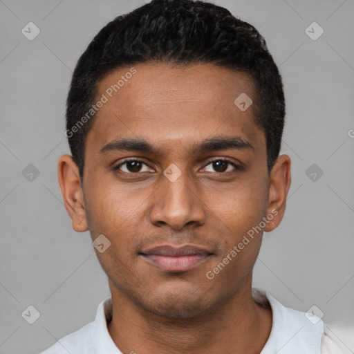 Joyful black young-adult male with short  black hair and brown eyes