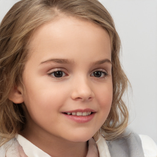 Joyful white child female with medium  brown hair and brown eyes