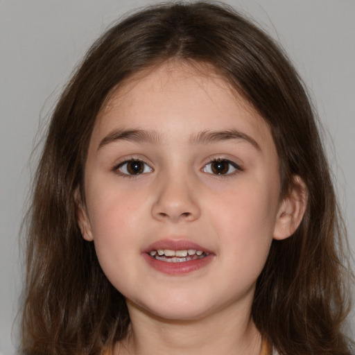 Joyful white child female with medium  brown hair and brown eyes