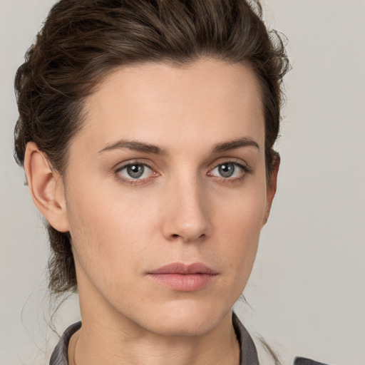 Neutral white young-adult female with short  brown hair and brown eyes