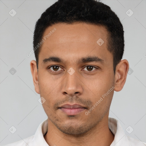 Neutral latino young-adult male with short  black hair and brown eyes