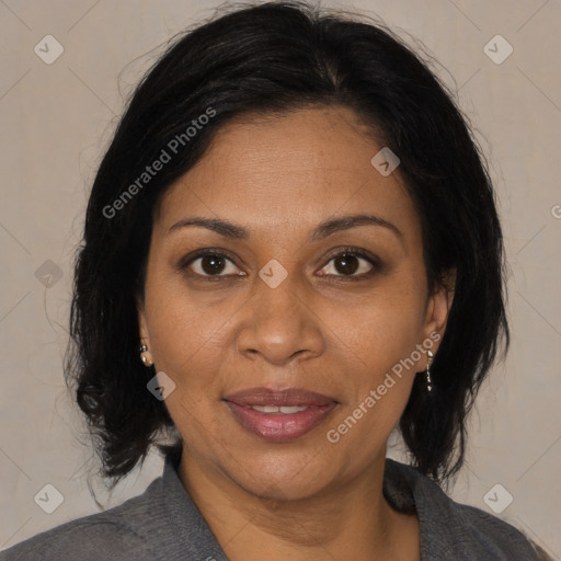 Joyful black adult female with medium  brown hair and brown eyes