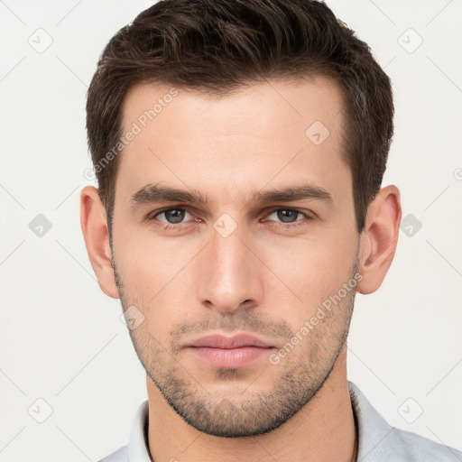 Neutral white young-adult male with short  brown hair and brown eyes